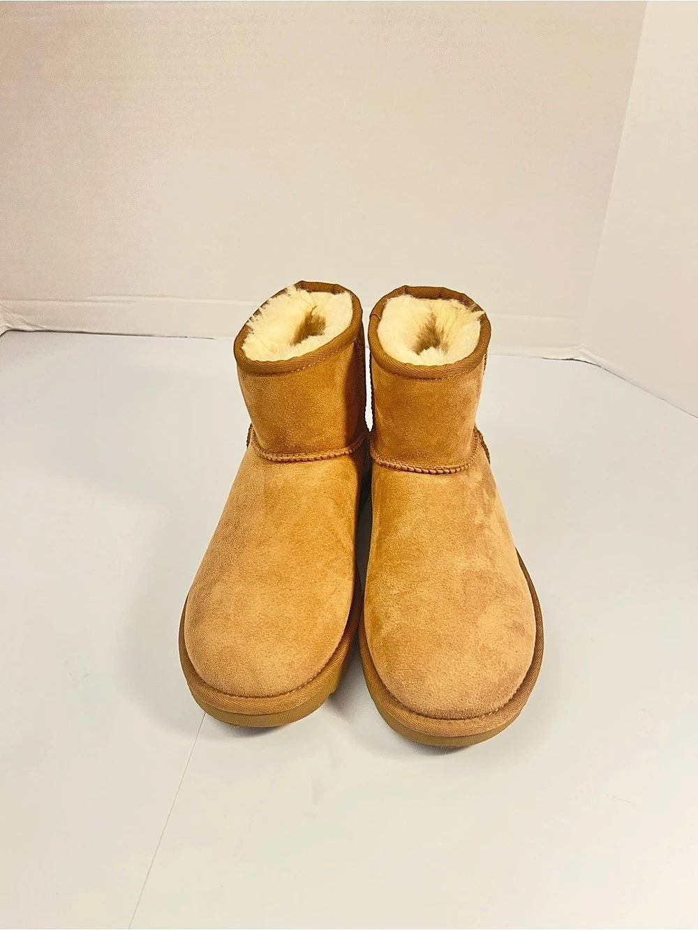 UGG Classic Ultra Mini Shearling-Lined Short Boots in Brown